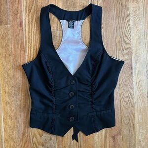 Black vest with lace details and tie up ribbon back